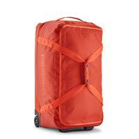 Bolso con Ruedas Black Hole® Wheeled Duffel 70L - Pollinator Orange