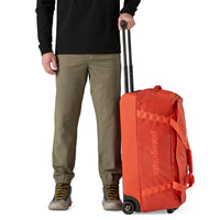 Bolso con Ruedas Black Hole® Wheeled Duffel 70L - Pollinator Orange