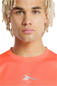Polera Tenth PES Papaya Fluor